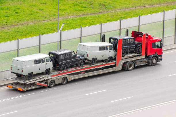 Heavy truck with trailer platform tow for transporting mini buses on the city highway