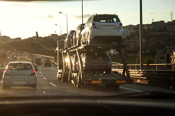 New cars transportation, truck transports cars, track in motion